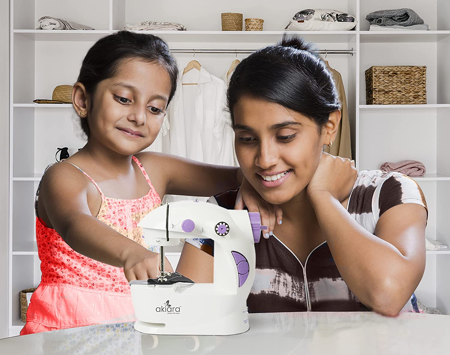 Akiara Mini Sewing Machine Kit with foot pedal & accessories. Portable electric stitching machine with dual speed & power supply. Perfect for home & beginners.